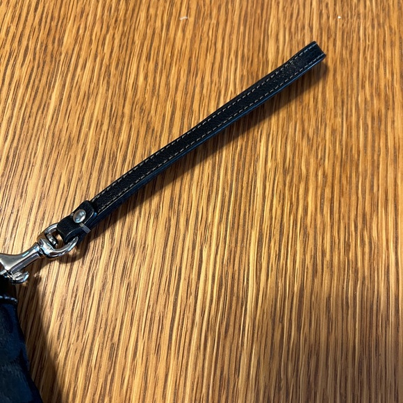 Black Coach clutch with zipper and one inside pocket. - Picture 6 of 9